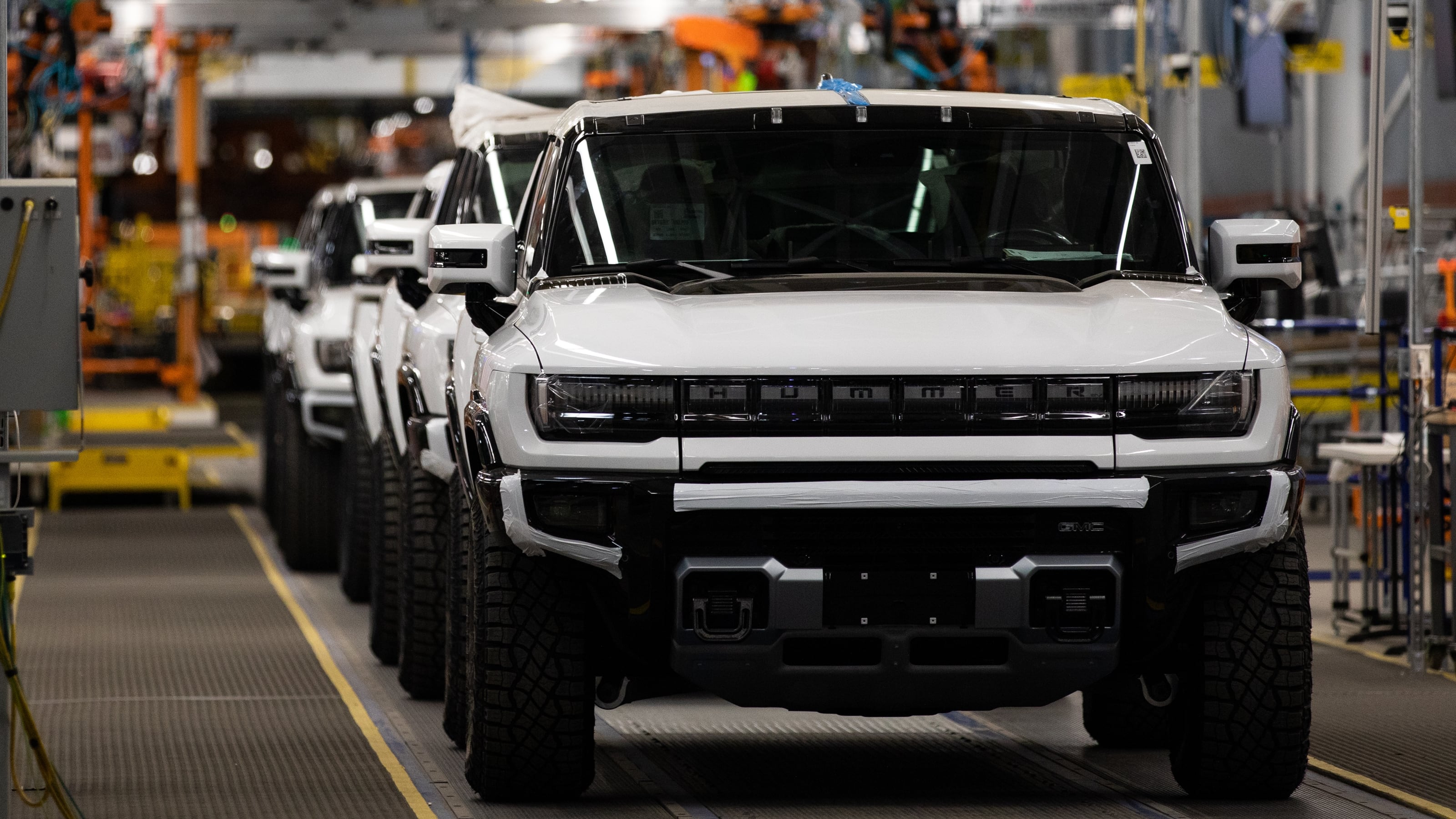 GMC Hummer electric vehicles on the production line at General Motors' Factory ZERO all-electric vehicle assembly plant in Detroit, Michigan, U.S., on Wednesday, Nov. 17, 2021. General Motors invested $2.2 billion in Factory ZERO, the single largest investment in a plant in GM history.